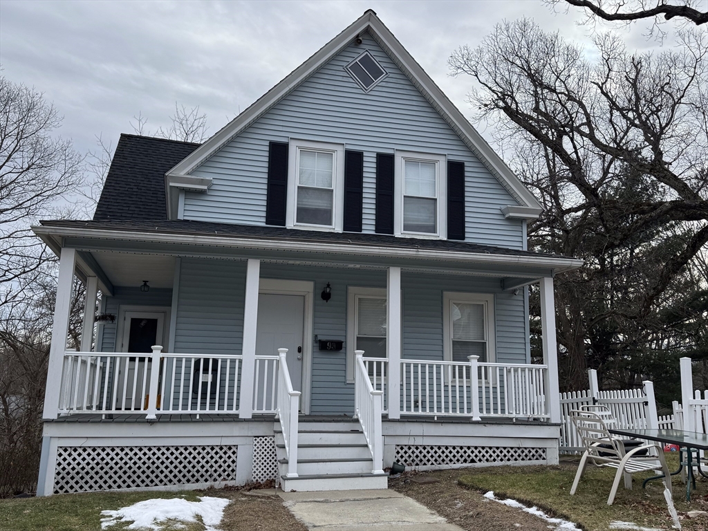 a view of a house with a bench