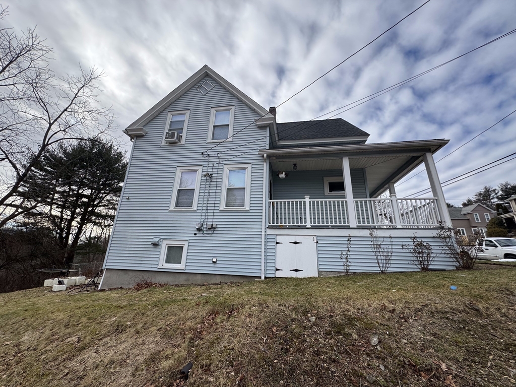 99 Clover Street Worcester, MA 01603 - Photo 2 of 8 a view of a house with a yard