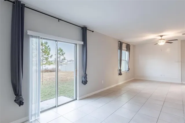 a view of an empty room with glass door