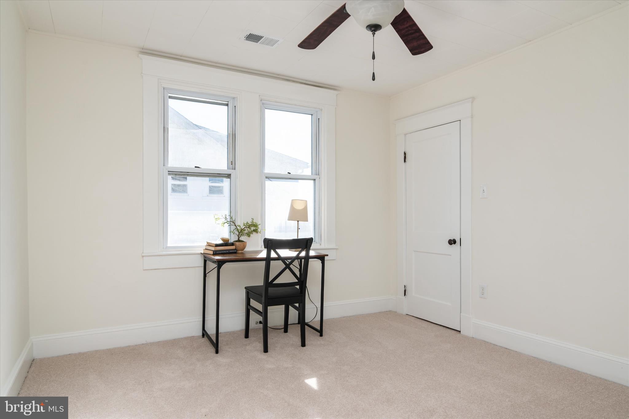 3827 Echodale Avenue Baltimore, MD 21206 - Photo 20 of 36 a view of a workspace with furniture and a window