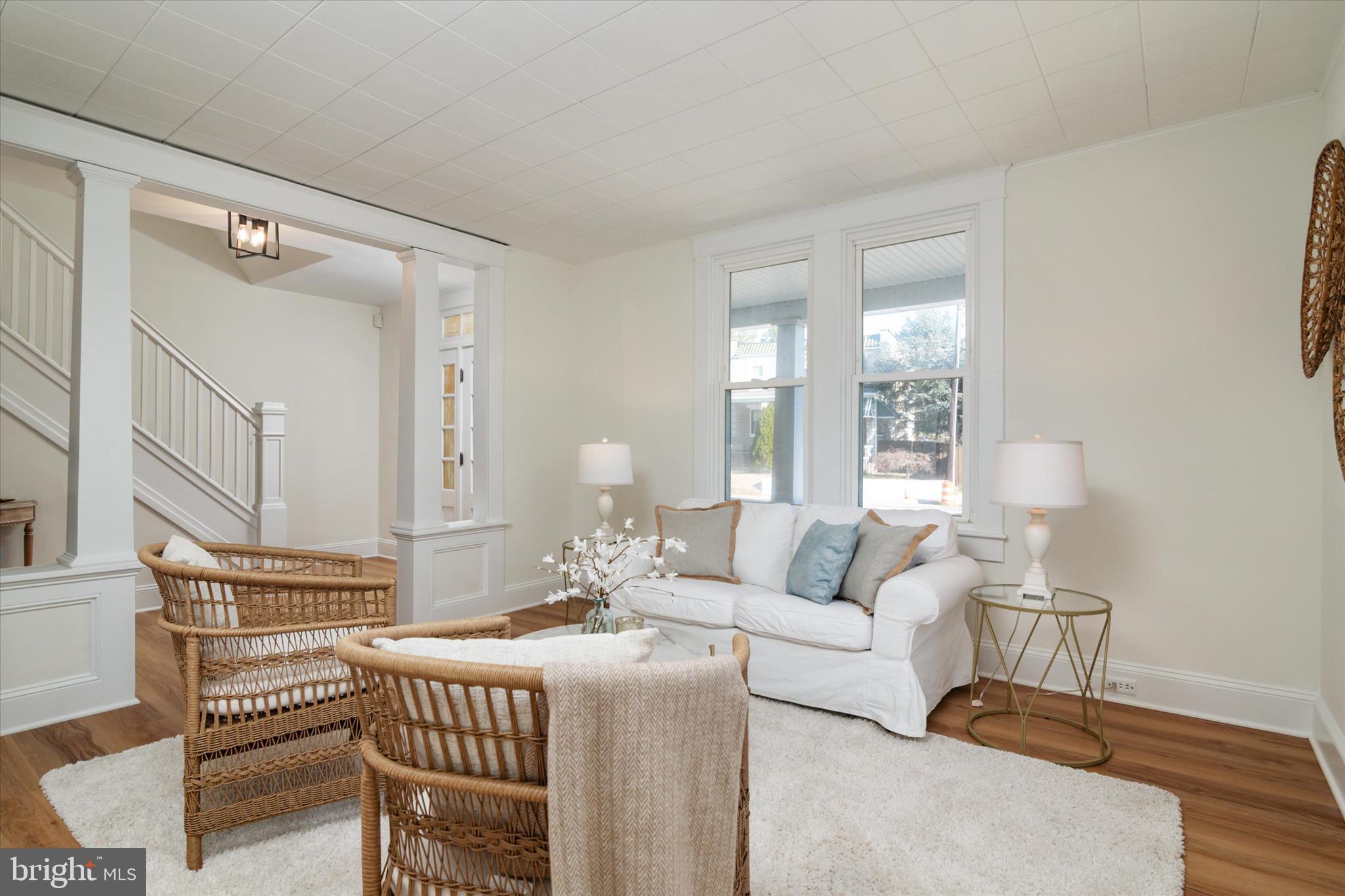 3827 Echodale Avenue Baltimore, MD 21206 - Photo 6 of 36 a living room with furniture a fireplace and a table