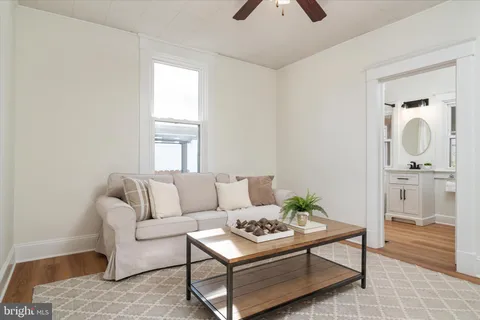 a living room with furniture and a rug