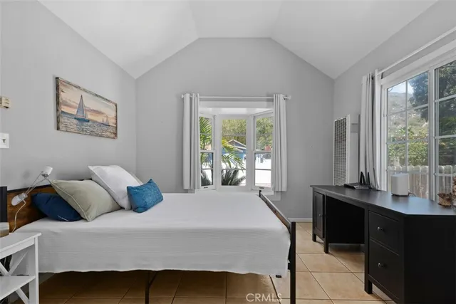 a bedroom with a bed and a desk