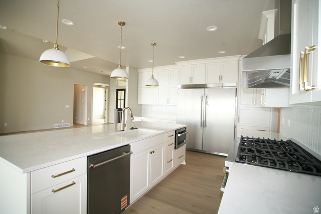 635 East Mountain Road North Ogden, UT 84414 - Photo 4 of 33 Kitchen featuring white cabinetry with gold-finish hardware, stainless steel appliances, and a gas range
