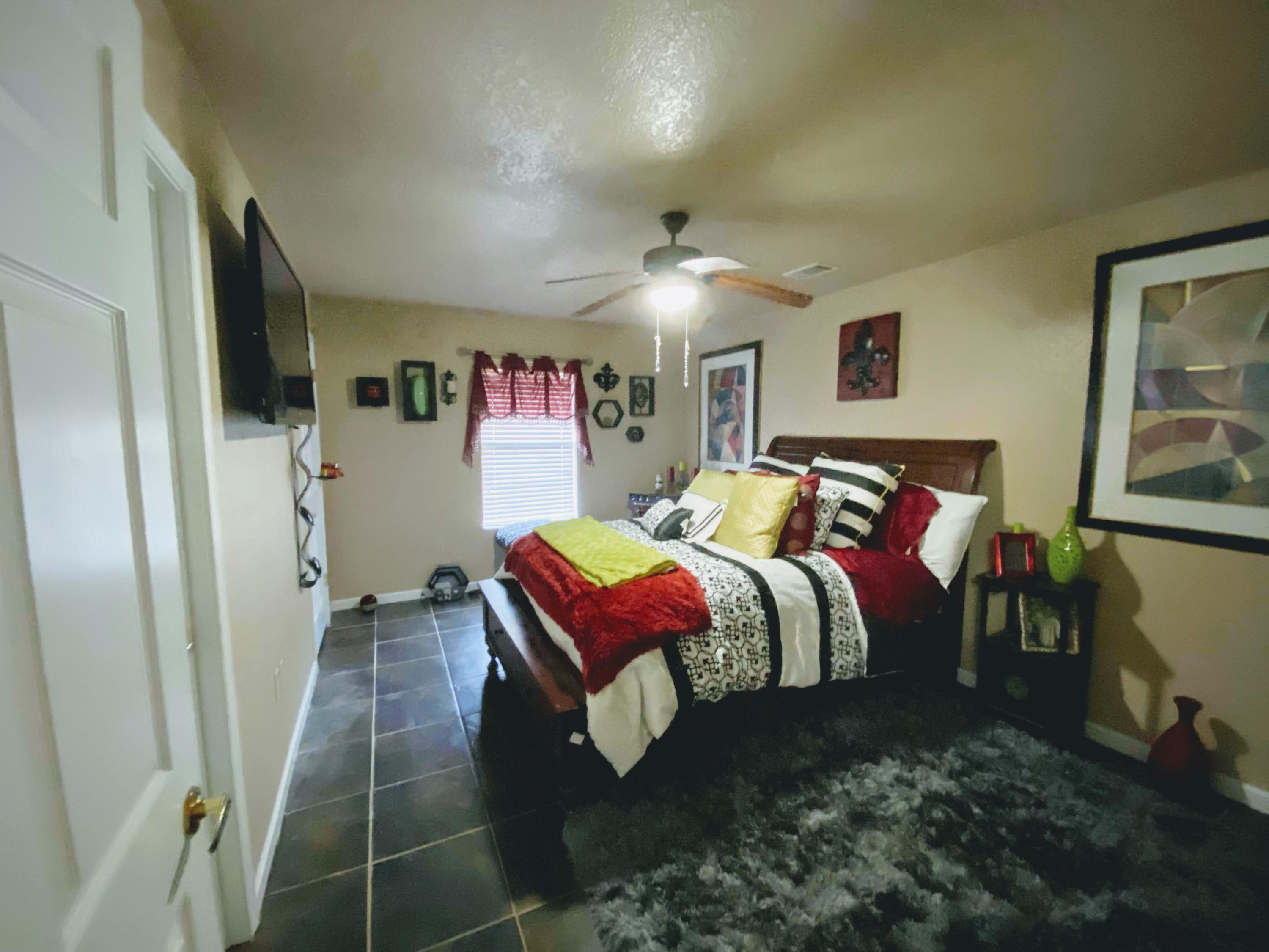 100 Sioux Circle Crestview, FL 32536 - Photo 11 of 36 a bedroom with a bed and a mirror