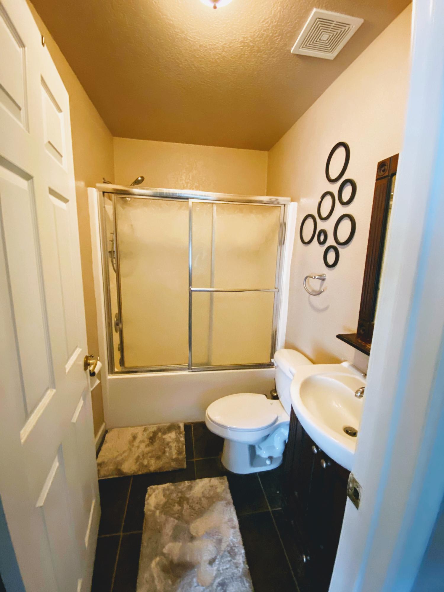 100 Sioux Circle Crestview, FL 32536 - Photo 15 of 36 a bathroom with a sink and a mirror