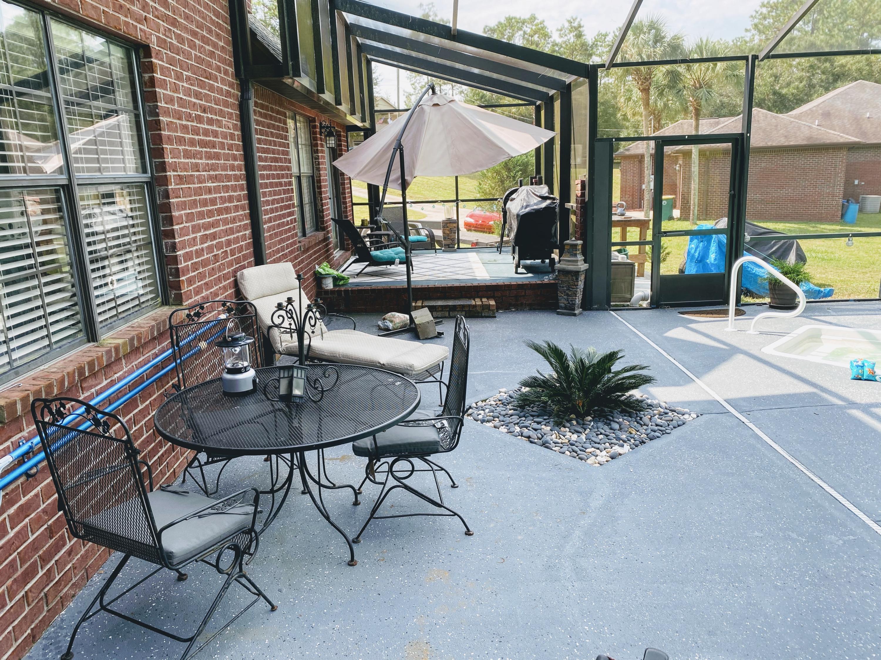 100 Sioux Circle Crestview, FL 32536 - Photo 29 of 36 a view of a house with backyard and sitting area