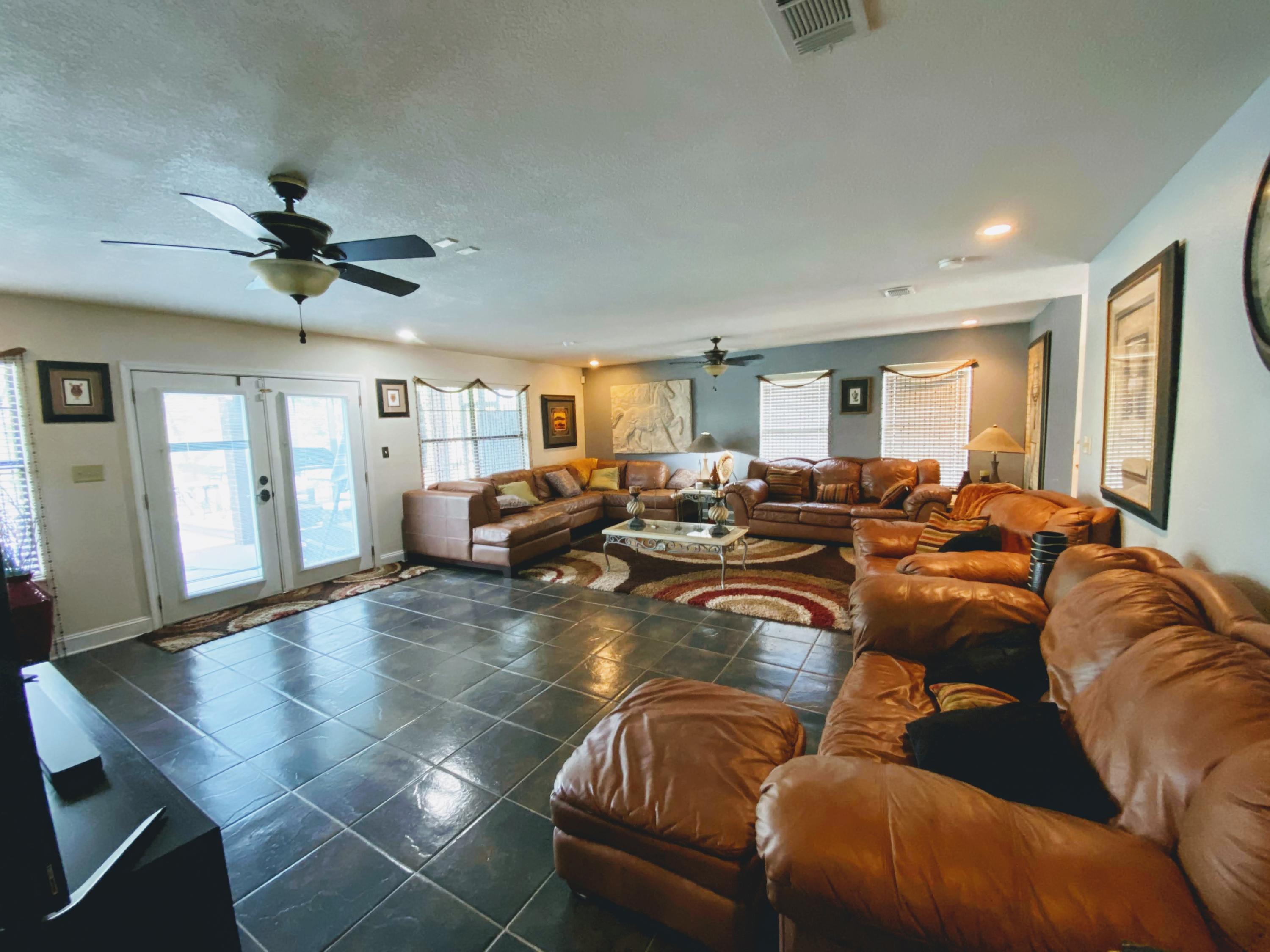 100 Sioux Circle Crestview, FL 32536 - Photo 3 of 36 a living room with furniture kitchen view and a chandelier