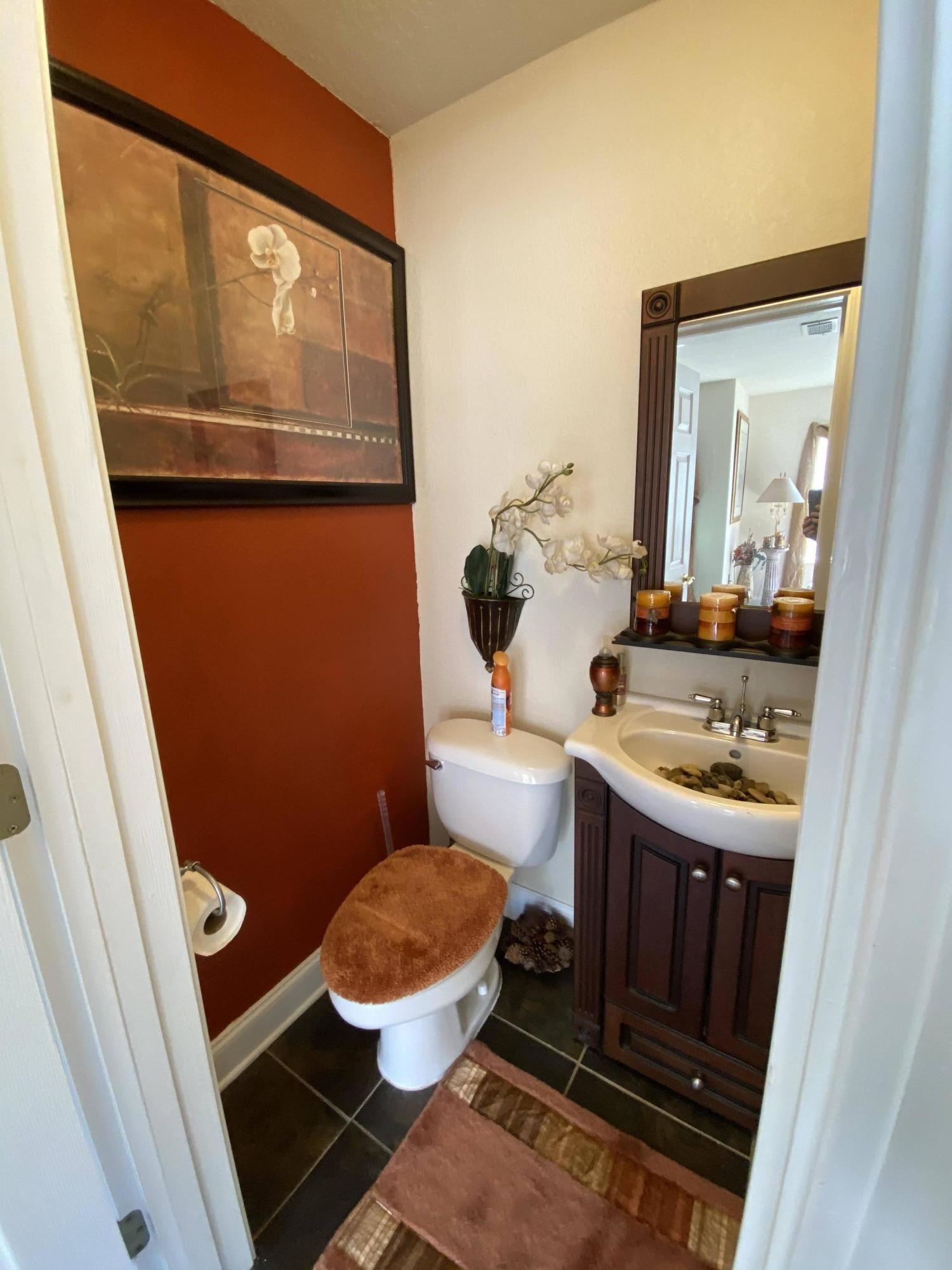 100 Sioux Circle Crestview, FL 32536 - Photo 7 of 36 a bathroom with a sink and a mirror