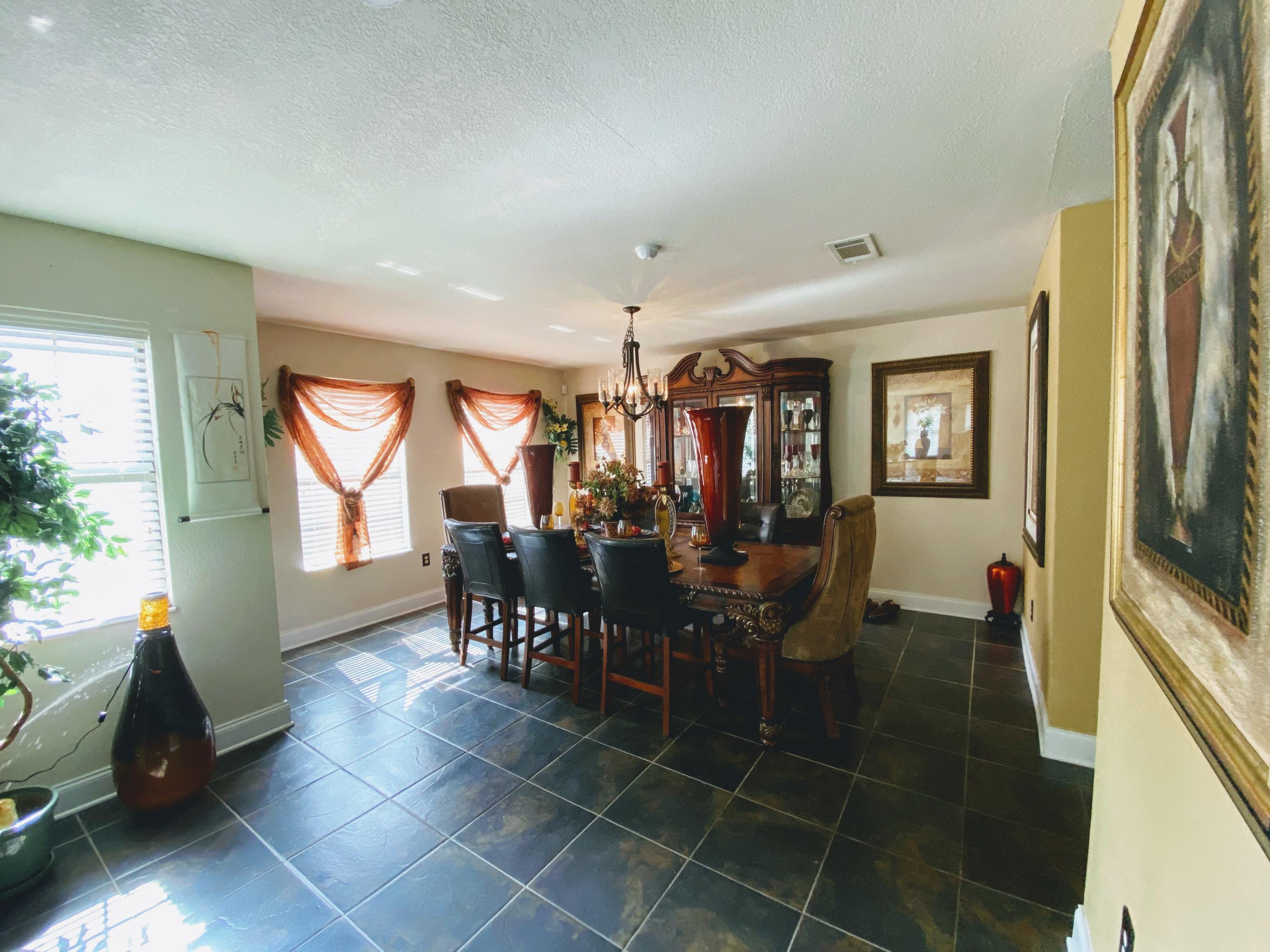 100 Sioux Circle Crestview, FL 32536 - Photo 8 of 36 a view of a dining room with furniture and window