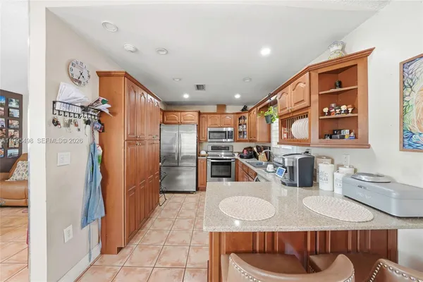 a bathroom with a sink vanity and a mirror