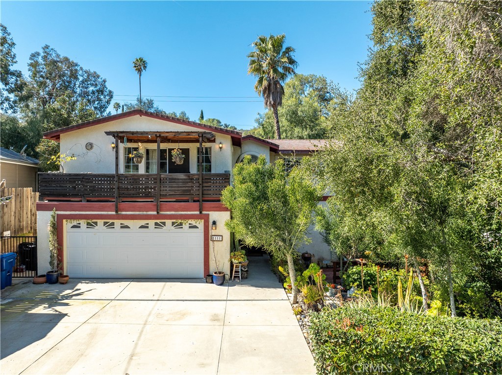 1111 Del Robles Place Simi Valley, CA 93063 - Photo 1 of 1 a front view of a house with a yard