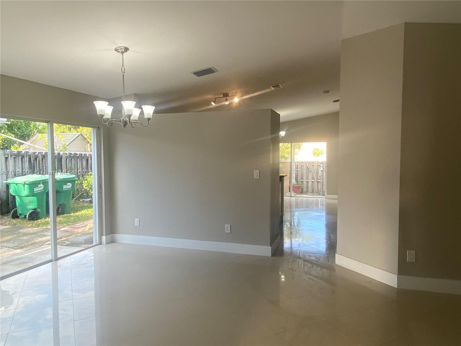 17501 Southwest 142nd Court Miami, FL 33177 - Photo 2 of 8 a view of a livingroom with a chandelier fan