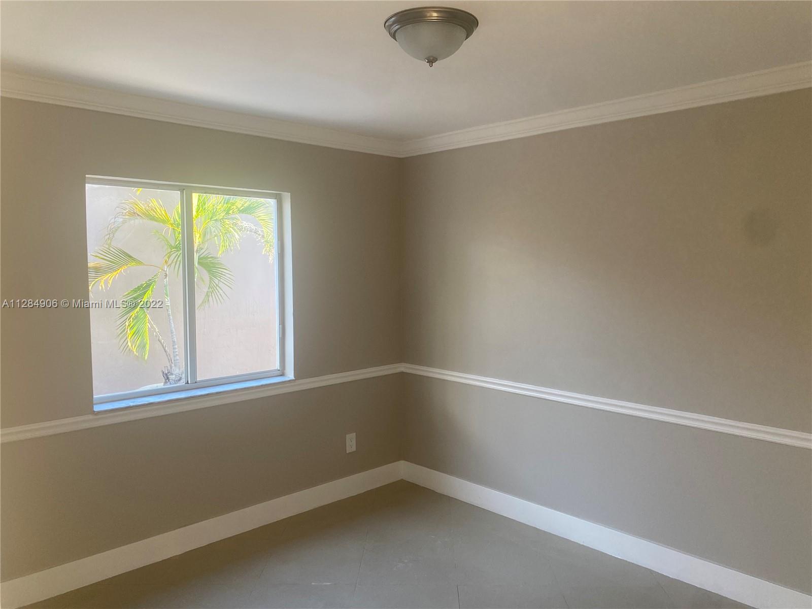 17501 Southwest 142nd Court Miami, FL 33177 - Photo 4 of 8 an empty room with a window