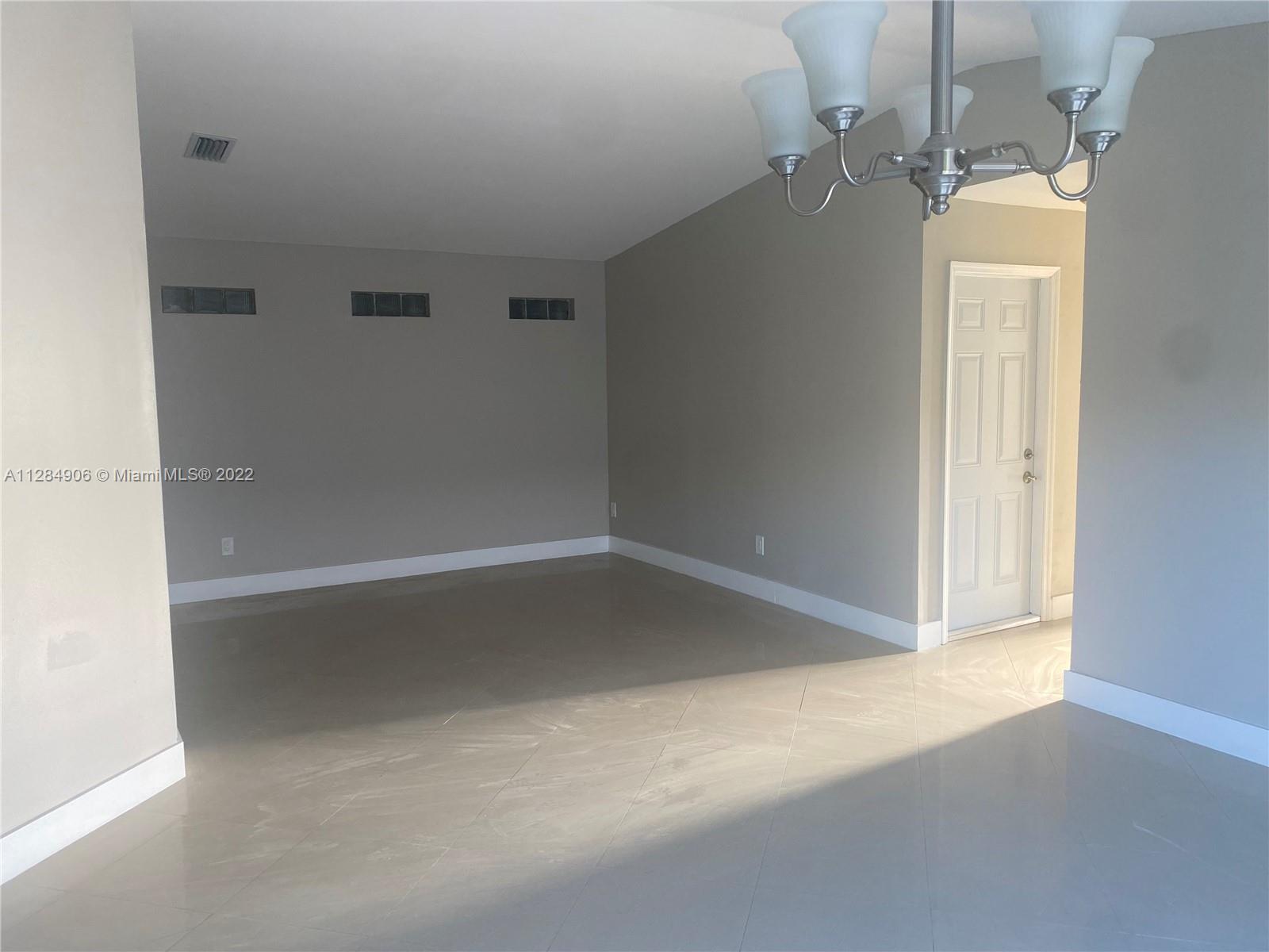 17501 Southwest 142nd Court Miami, FL 33177 - Photo 6 of 8 a view of a room with rack on the wall