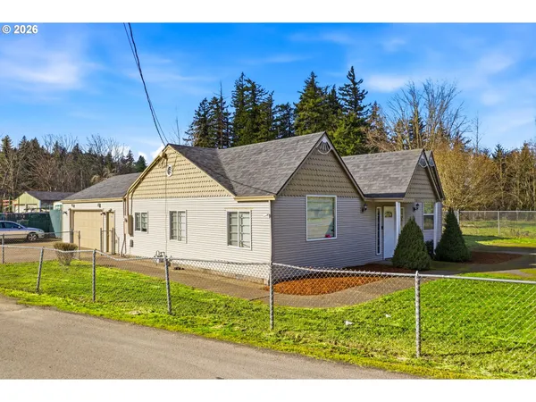 a view of a house next to a yard