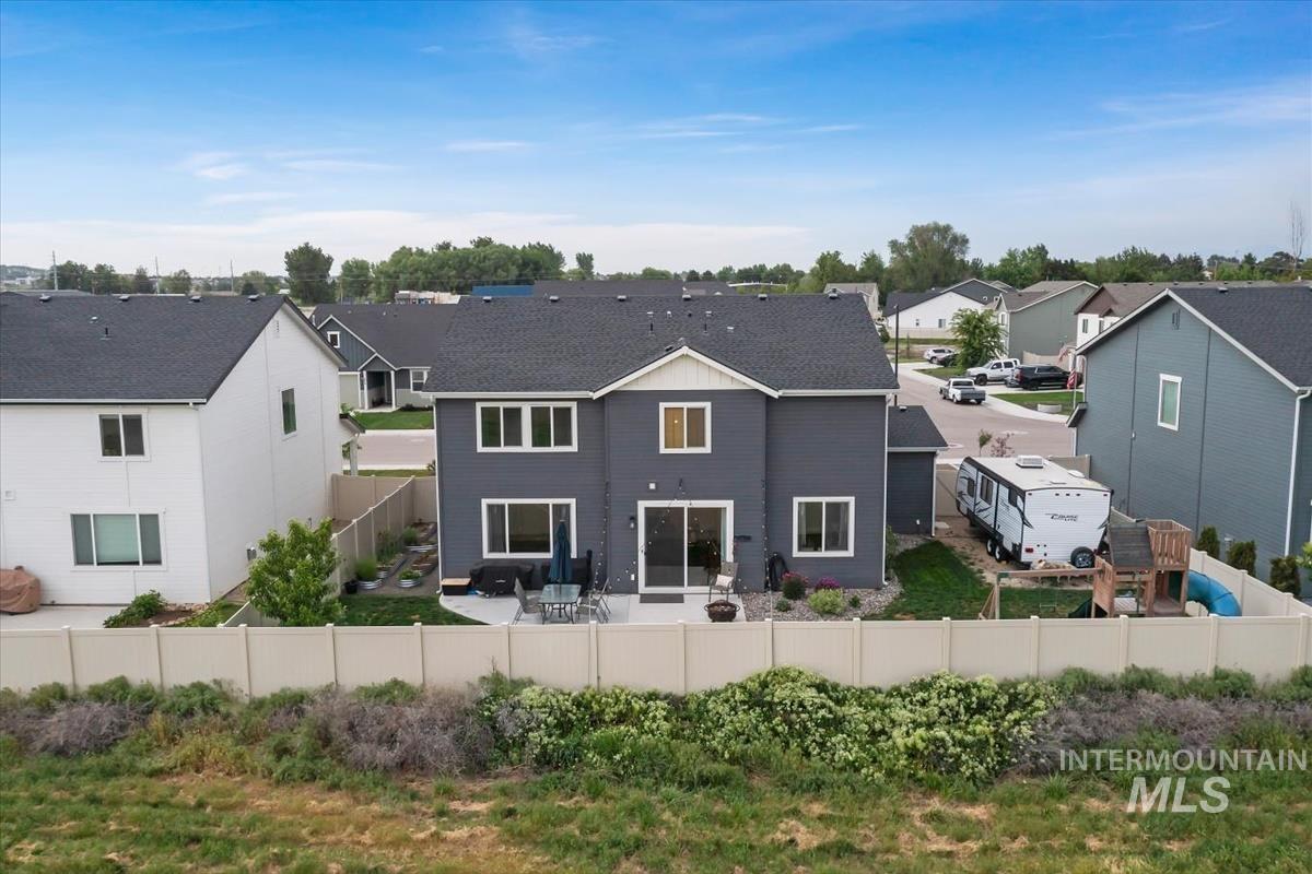 815 Knowledge Street Middleton, ID 83644 - Photo 47 of 49 Contemporary two-story residence featuring a dark gray exterior, white trim, and a prominent dark roof