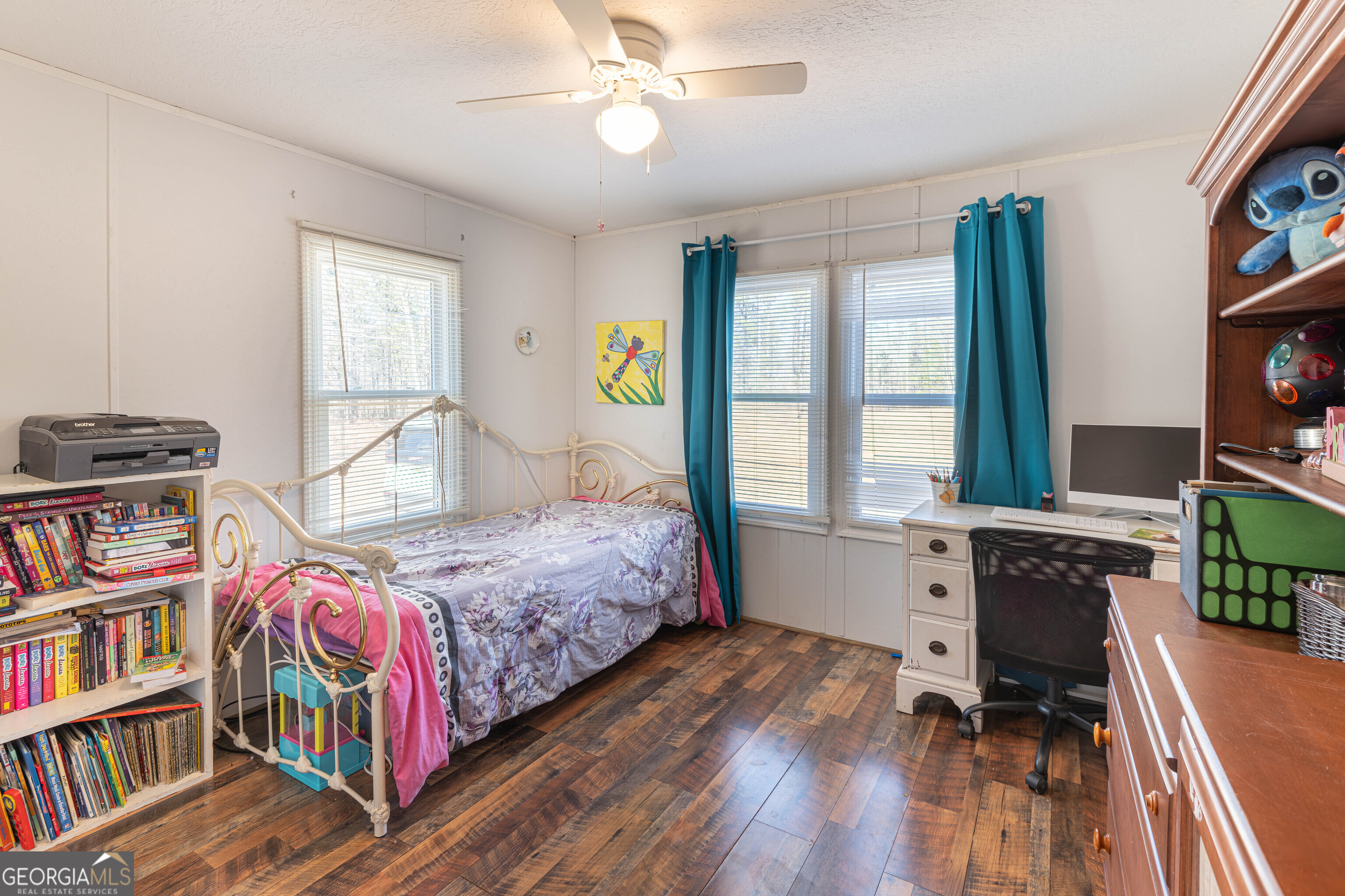 161 Cherokee Trail Forsyth, GA 31029 - Photo 20 of 32 a bedroom with a bed furniture and a book shelf