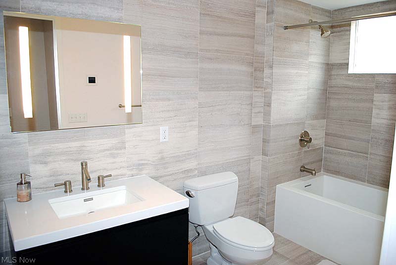 1856 Coltman Road Cleveland, OH 44106 - Photo 13 of 17 2nd Full Bath with resurfaced quartz tub and sink; heated floor and textured walls.