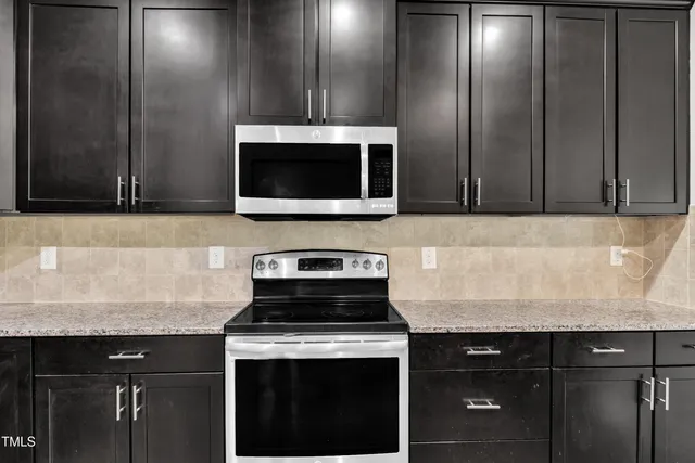 a kitchen with a stove and a microwave