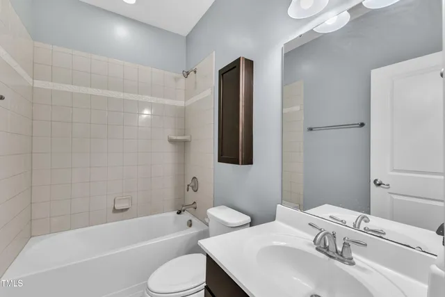 a bathroom with a sink toilet and bathtub