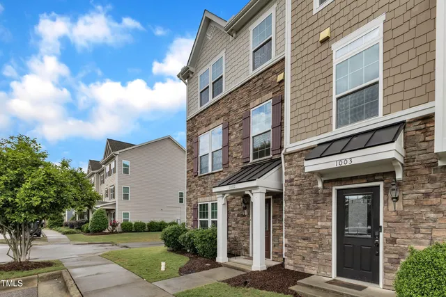 a view of a building with a yard