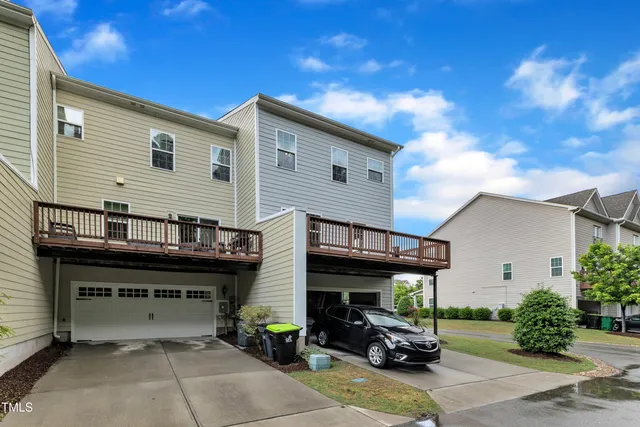 a view of a car park in front of house