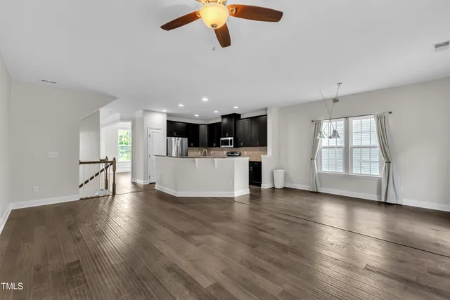 a view of kitchen with cabinets and wooden floor