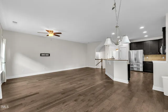 a view of a kitchen with a sink stainless steel appliances and cabinets