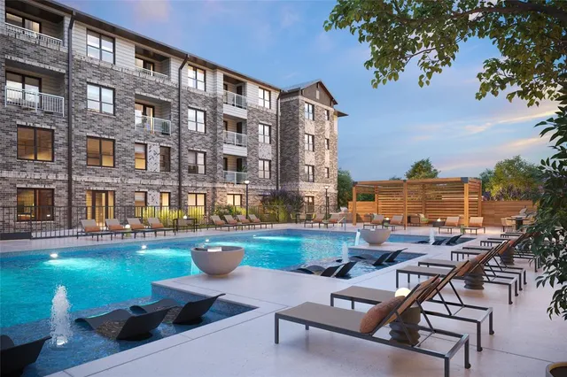 a view of a patio with couches and table and chairs and potted plants