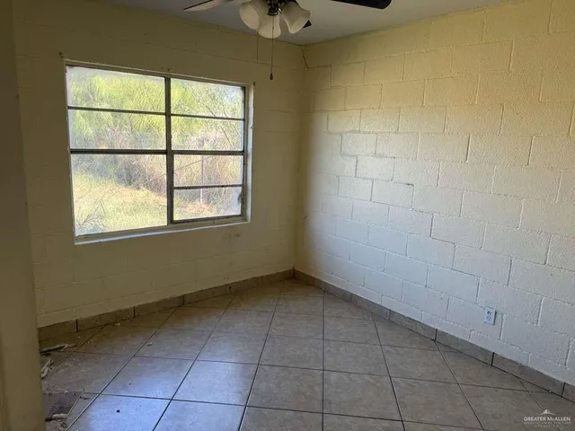 a view of a room that has a window in it