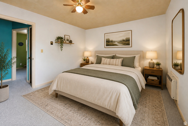 285 West 600 North, Unit 2 Logan, UT 84321 - Photo 9 of 21 Carpeted bedroom with a ceiling fan light fixture, light walls, and a warm-toned ceiling