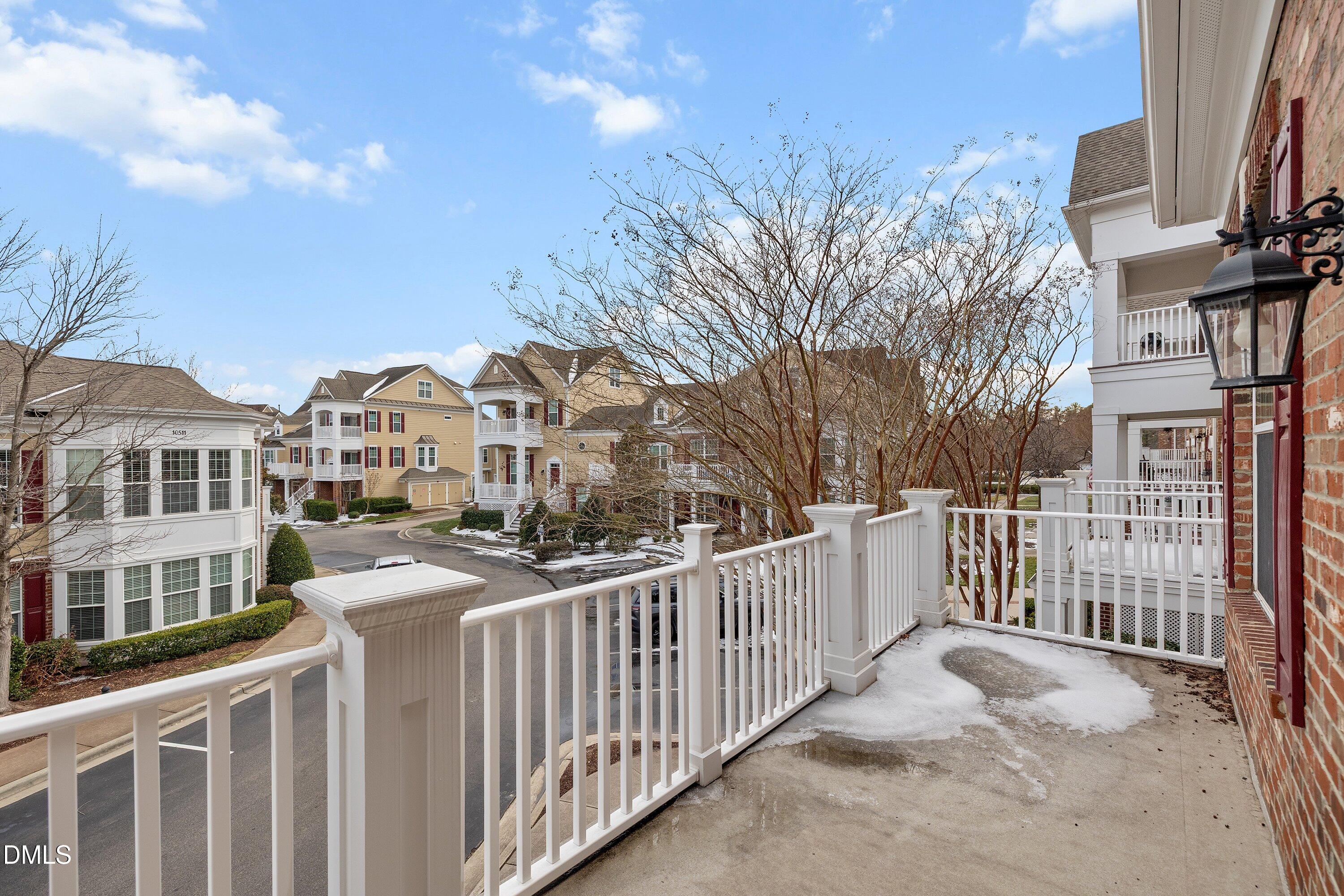 9211 Calabria Drive, Unit 205 Raleigh, NC 27617 - Photo 47 of 55 a view of a white house with wooden fence