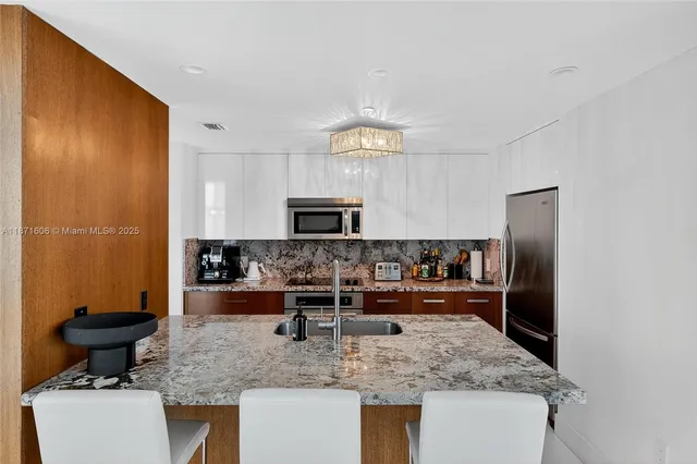 $1,395,000 | 7935 East Drive, Unit 1104, North Bay Village, FL 33141