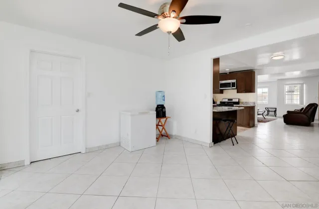 a view of kitchen with furniture and flat screen tv