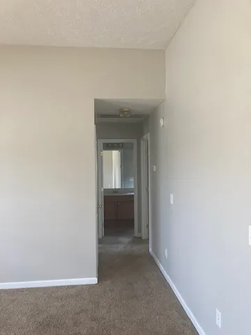 a bathroom with a toilet a sink a vanity and mirror