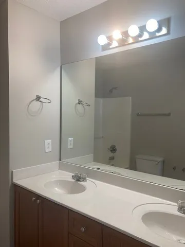 a bathroom with a toilet and a bathtub
