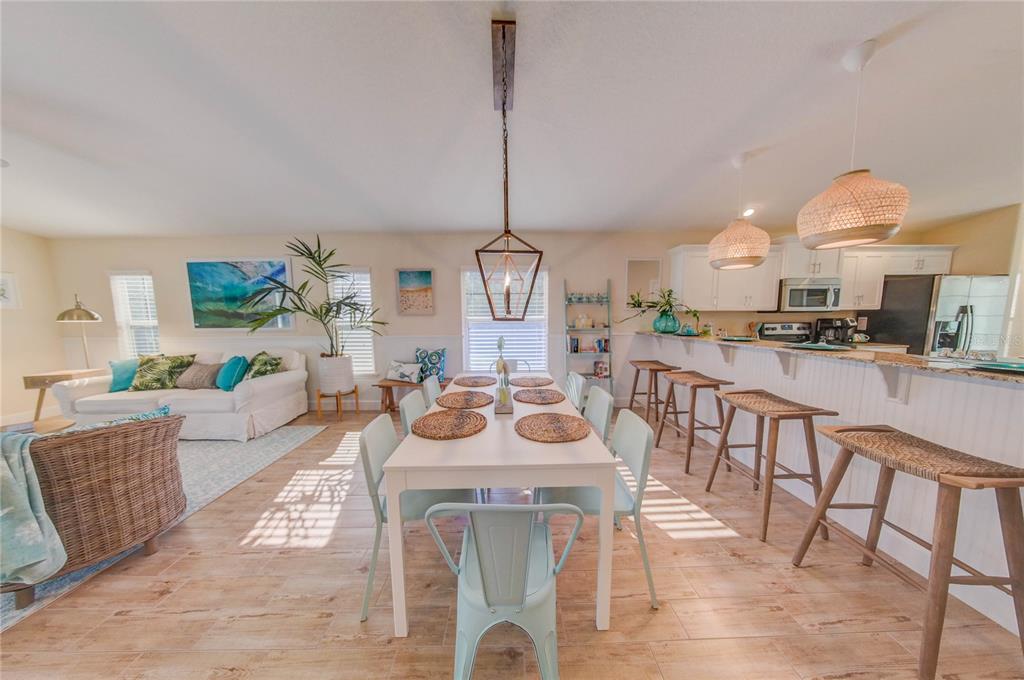 27 Mala Compra Road Palm Coast, FL 32137 - Photo 11 of 57 a view of a dining room with furniture window and wooden floor