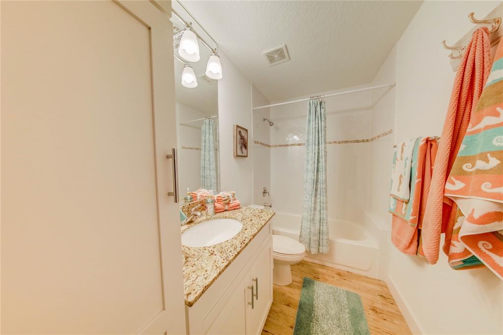 27 Mala Compra Road Palm Coast, FL 32137 - Photo 28 of 57 a bathroom with a granite countertop sink and a mirror