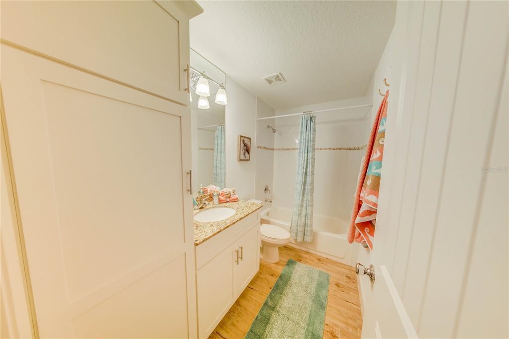 27 Mala Compra Road Palm Coast, FL 32137 - Photo 29 of 57 a bathroom with a sink a mirror and a shower