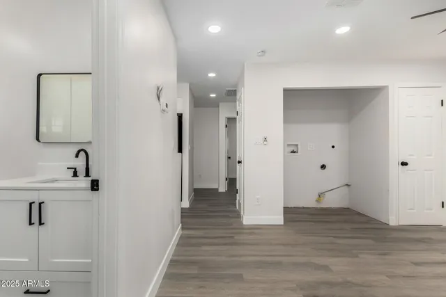 a view of a bathroom with a shower and a sink