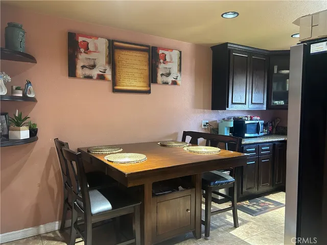 a kitchen with a table and chairs in it