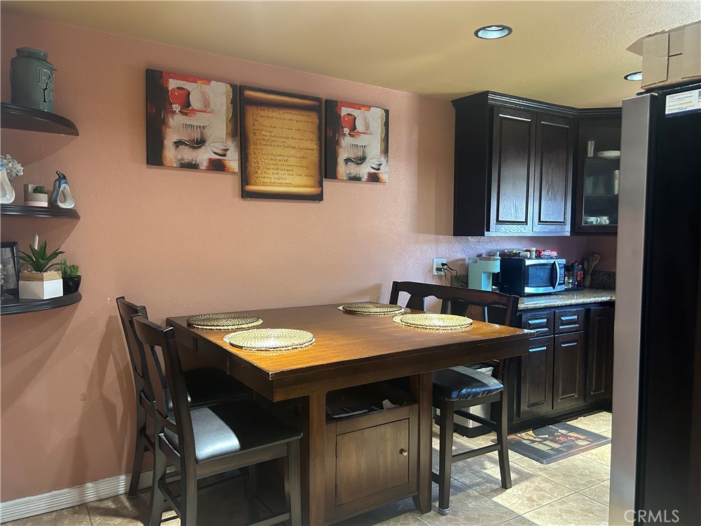 a kitchen with a table and chairs in it