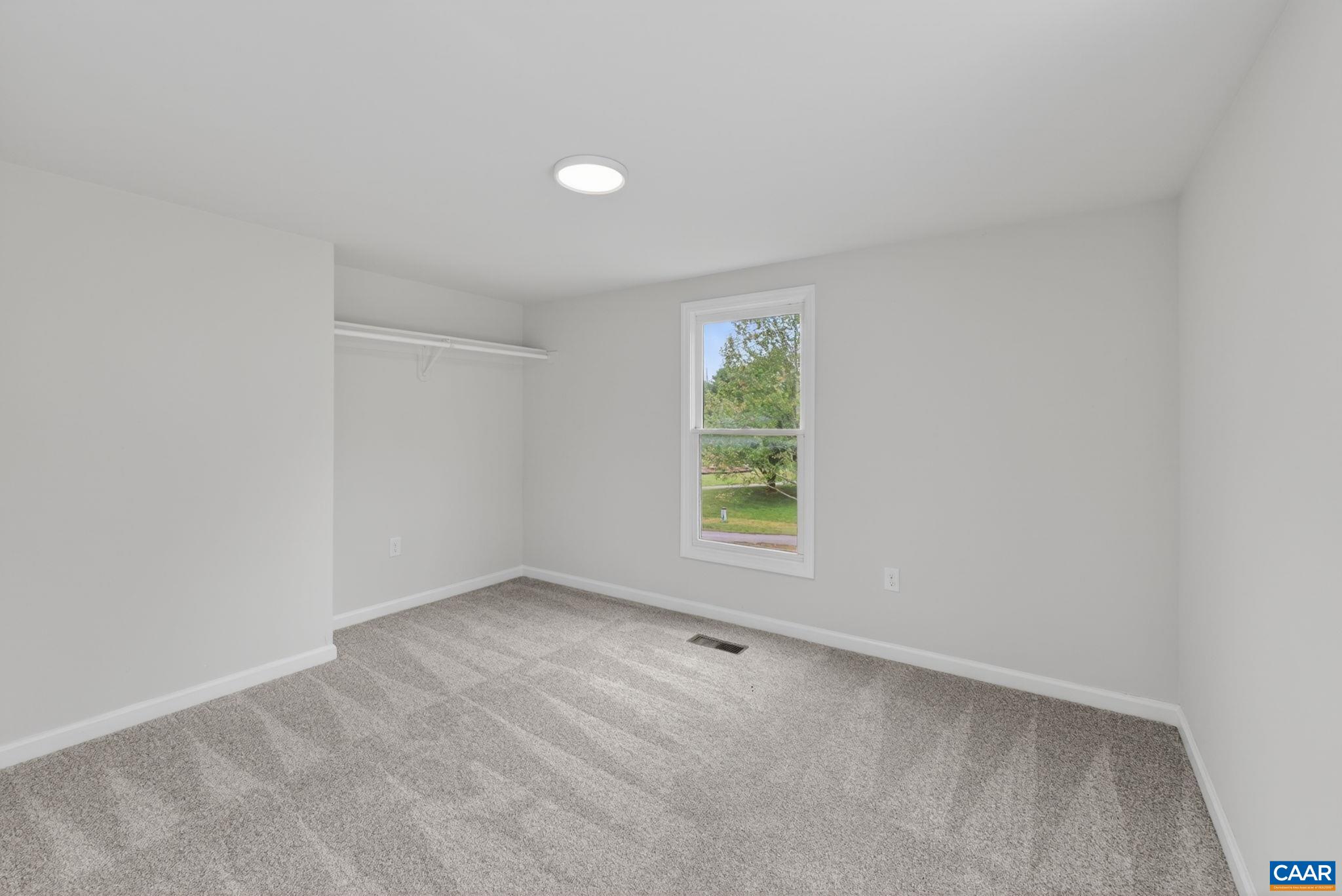 908 Rives Street Charlottesville, VA 22902 - Photo 19 of 33 an empty room with a window
