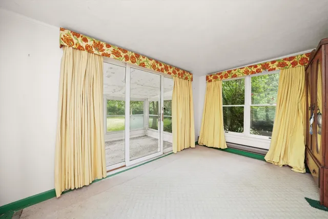 a view of an empty room and window