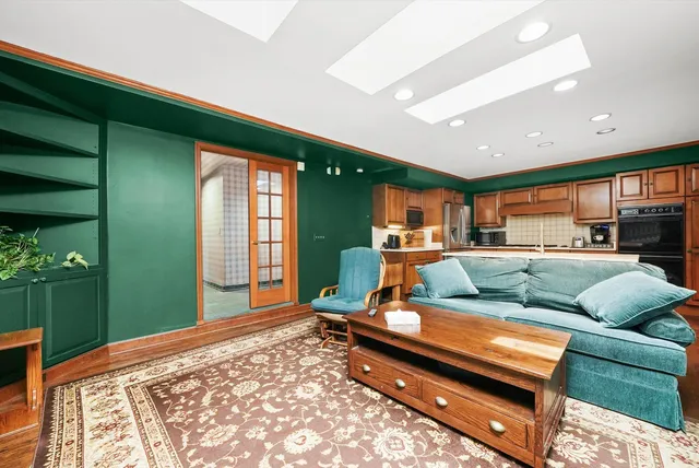 a living room with furniture and a yard