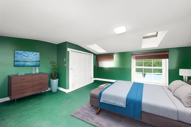 a bedroom with a bed and a dresser