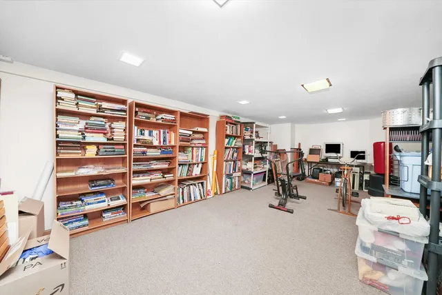 a living room with lots of furniture and a flat screen tv