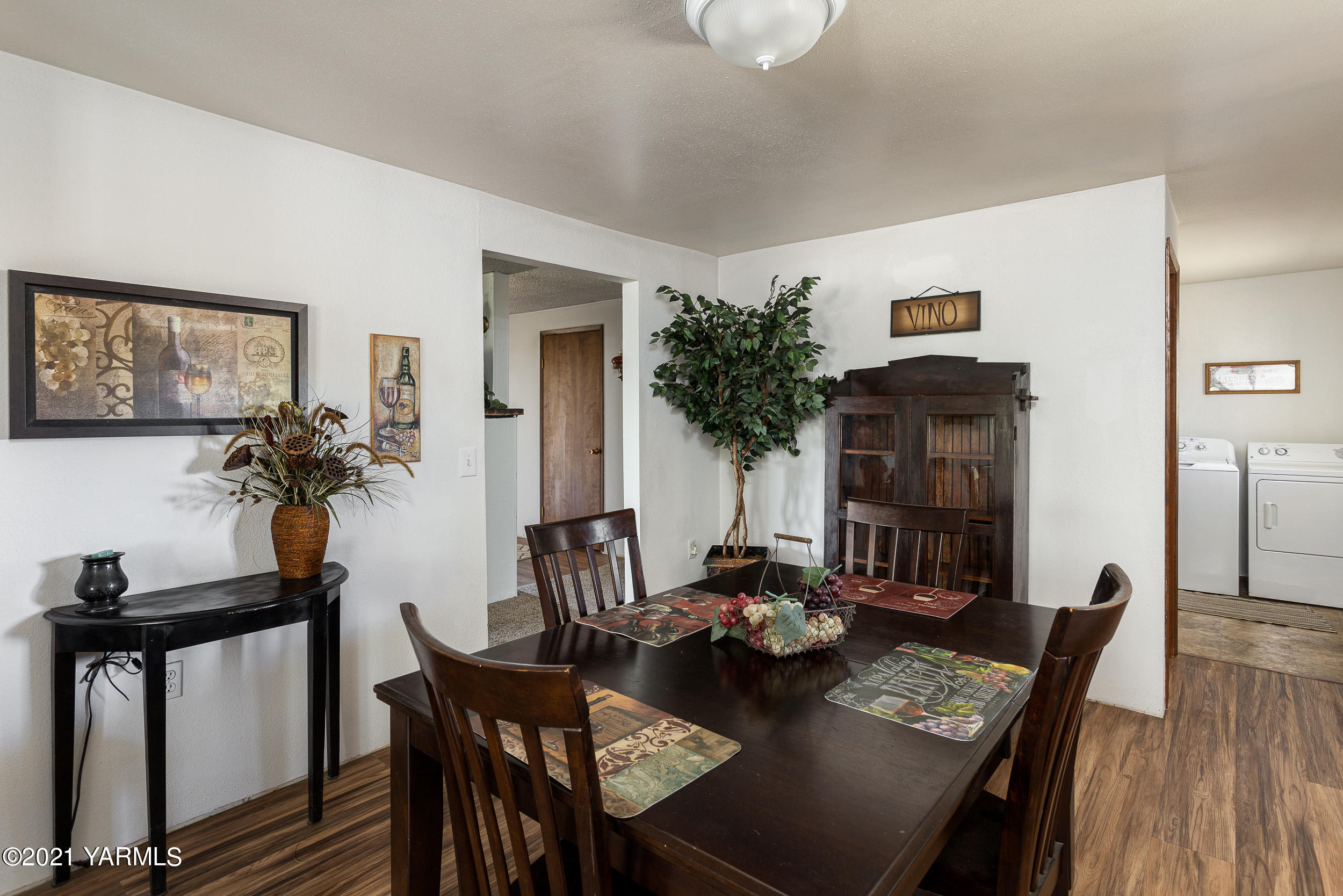 10605 Summitview Ext Road Yakima, WA 98908 - Photo 8 of 32 a view of a dining room with furniture and wooden floor