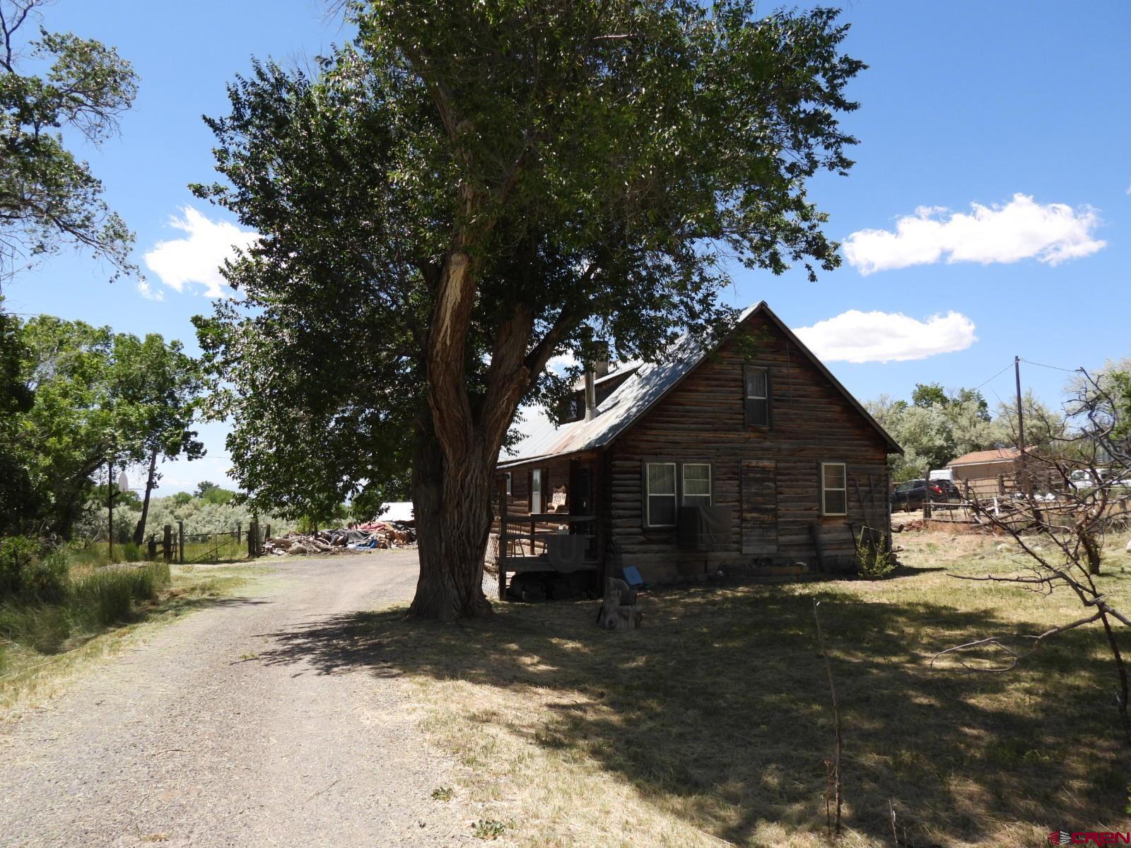 21764 R Road Cedaredge, CO 81413 - Photo 1 of 27 a view of a house with a yard